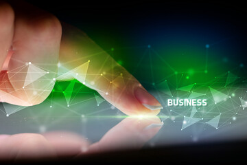 Finger touching tablet with business connection concept