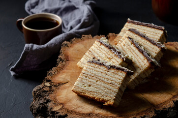 Baumkuchen on black background, Slice of baumkuchen with chocolate.