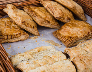 Assorted organic pasties and sausage rolls on sale at a farmers market