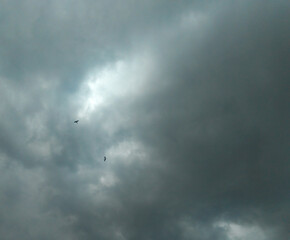 Beautiful blue sky background with dark clouds, sunset scenery view, weather conditions, nature photography, time lapse of clouds