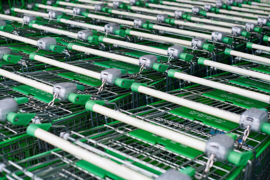 Row of parked trolleys or shopping carts in supermarket