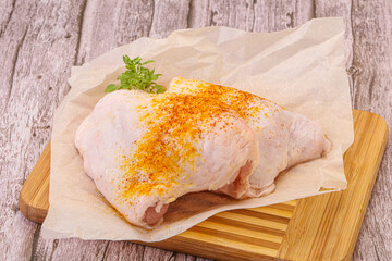 Raw chicken thigh with spices