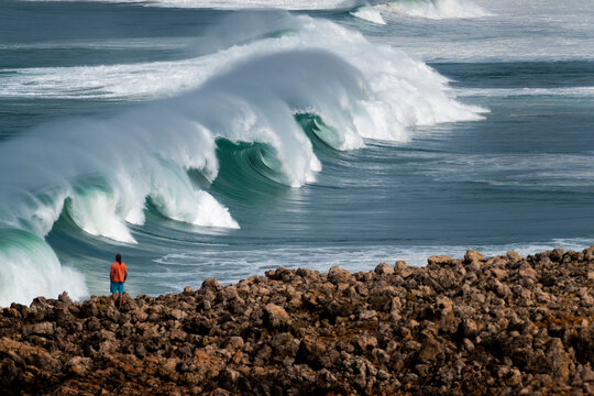 A set of waves breaking at the Bordeira Beach (Praia da Bordeira) in Algarve, Portugal