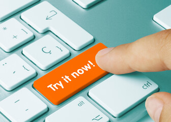 Try it now! - Inscription on Orange Keyboard Key.
