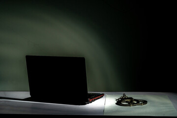 Scammer with low light setting with security awareness concept.