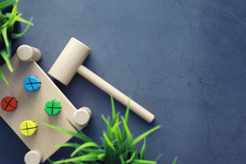 Children's development. Children's wooden toy on the table in the play area. Room of children's creativity and self-development. Wooden constructor.