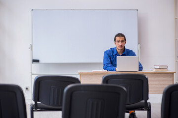 Fototapeta premium Young male business trainer making presentation during pandemic