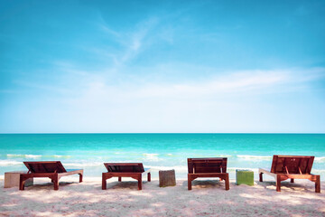 Summer background, Sunbath lounge chair on the beach with beautiful sea in daytime