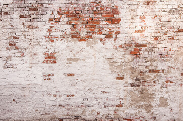 Abstract red white stonewall urban texture. Old red brick wall with shabby damaged white plaster. Painted whitewashed brickwall grungy background. Stonework frame grunge empty wallpaper.