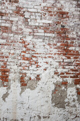 Abstract red white stonewall urban texture. Old red brick wall with shabby damaged white plaster. Painted whitewashed brickwall grungy background. Stonework frame grunge empty wallpaper.