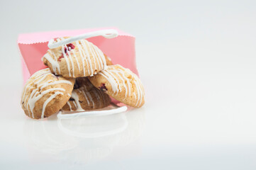 cookies glazed in pink shopping bag on a white background. The concept of copy space.