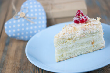 Delicious of piece cake on plate on wood table