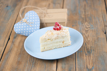 Delicious of piece cake on plate on wood table