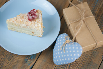 Delicious of piece cake on plate on wood table