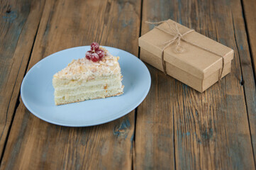 Delicious of piece cake on plate on wood table
