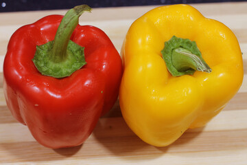two bell peppers red and yellow 