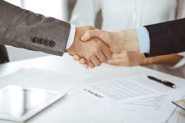 Business people shaking hands finishing contract signing, close-up. Business communication concept. Handshake and marketing