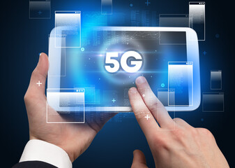 Close-up of a hand holding tablet