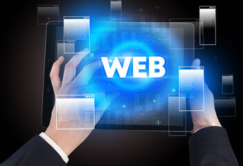 Close-up of a hand holding tablet