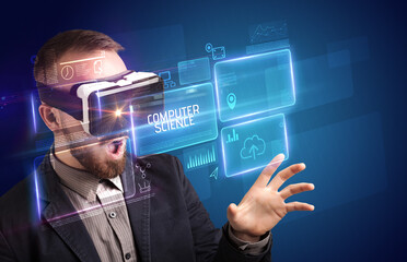 Businessman looking through Virtual Reality glasses, tech concept