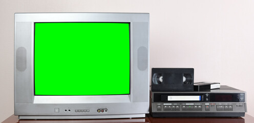 Old silver vintage TV with green screen to add new images to the screen, VCR on wallpaper background.	1980s,1970s.