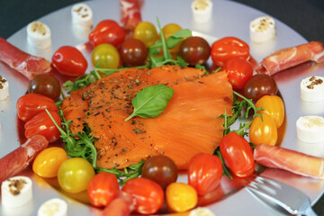 A cold meat platter with fresh salmon