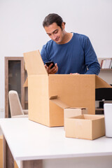 Fototapeta premium Young man moving to new flat