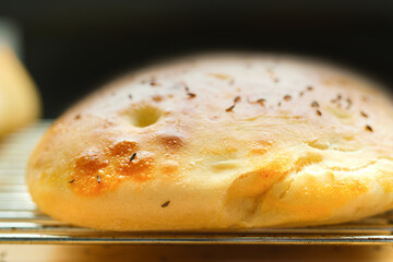 Fresh flat bread from the oven on a grate