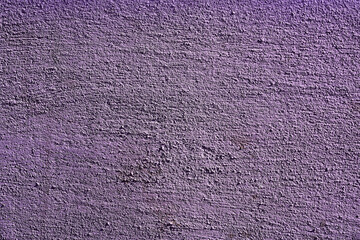 close-up on the structure of the wall with purple plaster 
