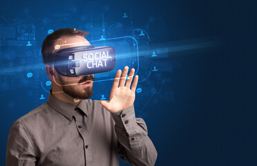 Fototapeta na wymiar Businessman looking through Virtual Reality glasses, social media concept