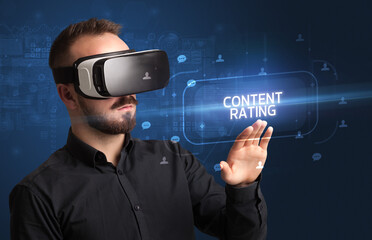 Businessman looking through Virtual Reality glasses, social media concept
