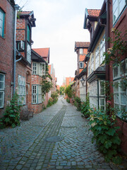 Beautiful streets of the old center of Luneburg in lower saxony germany in soft light at day with...