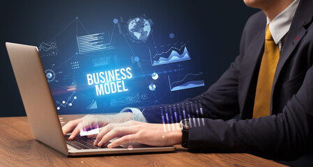 Businessman working on laptop, business concept