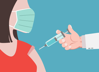 Doctor in a clinic giving a coronavirus vaccine to a woman with face mask