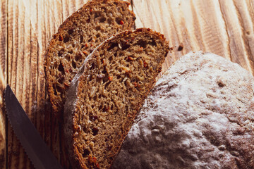 Sliced fresh rye bread on a wooden table