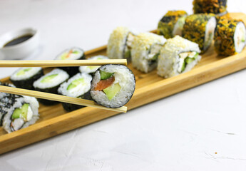 Fried rolls, classic on a wooden tray.