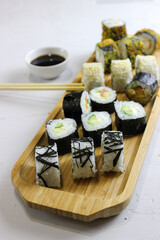 Fried rolls, classic on a wooden tray.