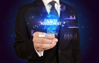 Businessman holding a light bulb, new business concept