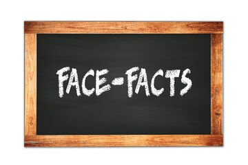 Fototapeta premium FACE-FACTS text written on wooden frame school blackboard.