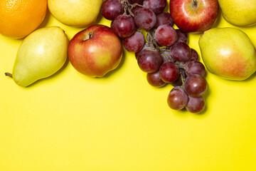 Fruit on a yellow background. Healthy diet. fruit theme, there is a place for an inscription and a logo