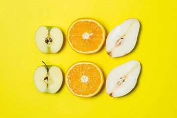 Sliced fruits on a yellow background. Healthy diet. fruit theme. Bright fruit