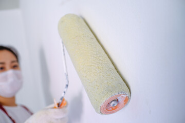 Asian woman painter painting Job in room