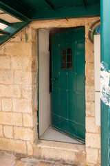The iron-bound  door at the side entrance to the Madrasah on the Temple Mount in the Old Town of Jerusalem in Israel