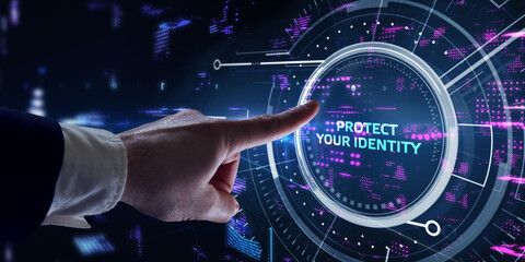 Cyber security data protection business technology privacy concept. Young businessman  select the  Protect your identity on the virtual display.
