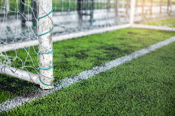 Selective focus to goal post on artificial turf. Sport and football background.