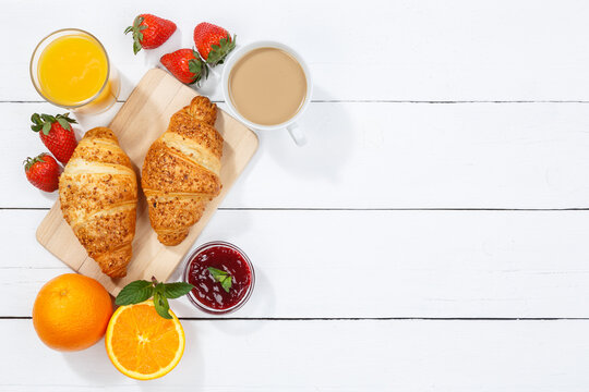 Croissant breakfast croissants orange juice coffee food wooden board from above copyspace copy space