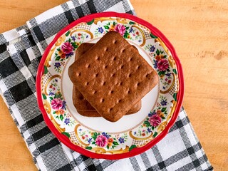 chocolate biscuits cookies on wooden table.