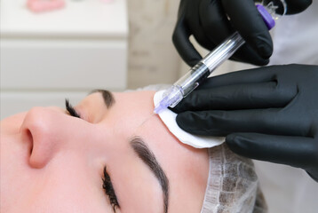 Cosmetic injections for skin rejuvenation. Cosmetologist injects