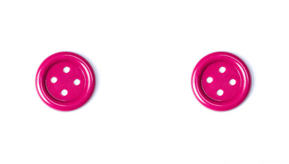 Pink buttons on a white background close-up. Beautiful bright buttons isolate for cutting out. Copy space. Top view. Flat lay. Button for crafts.