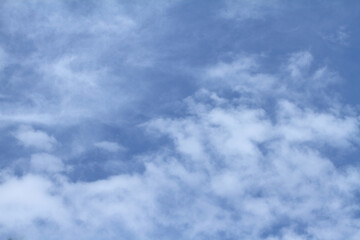 Beautiful blue sky and white clouds of various shapes with sunlight Nature background